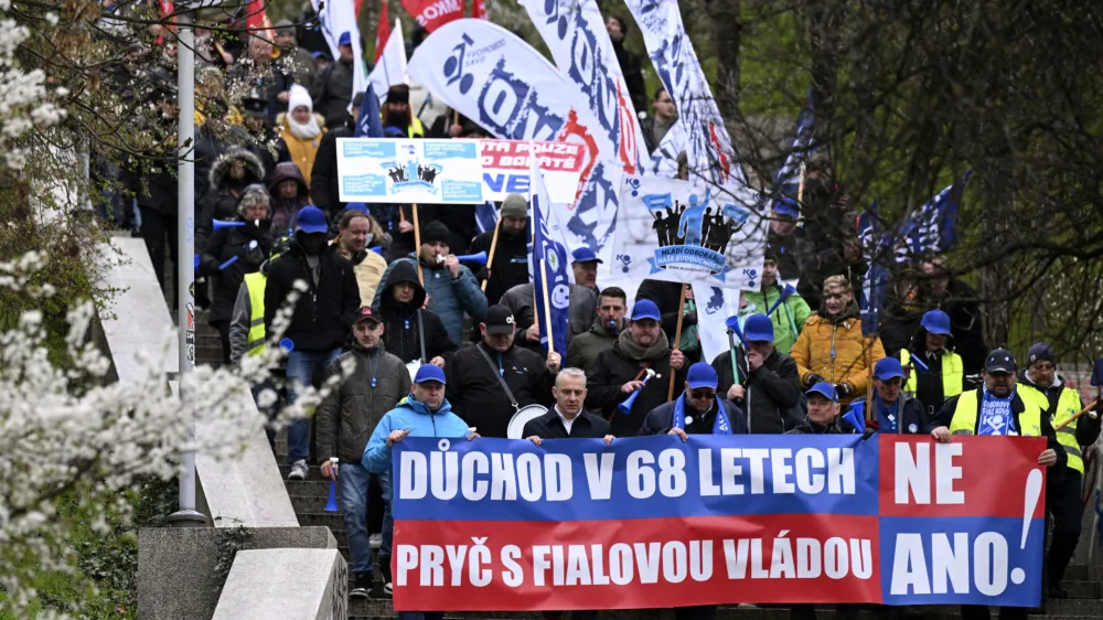 Protesters march during a demonstration of the KOVO trade union against the changes in the pension system considered by the government, in Prague, Czech Republic, Wednesday March 29, 2023. (Michal Kamaryt/CTK via AP)