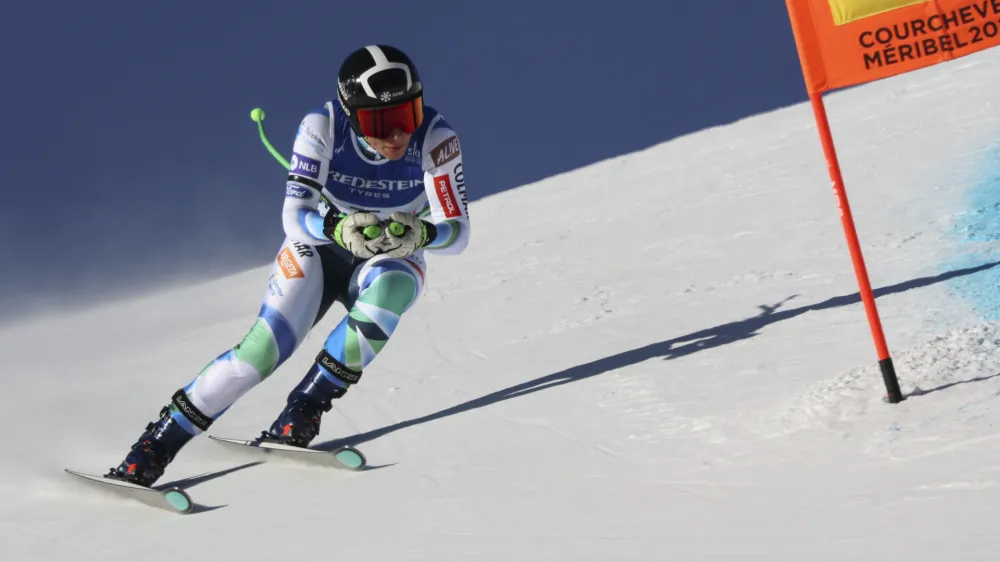 Slovenia's Ilka Stuhec speeds down the course during an alpine ski, women's World Championships downhill training, in Meribel, France, Friday, Feb. 10, 2023. (AP Photo/Marco Trovati)