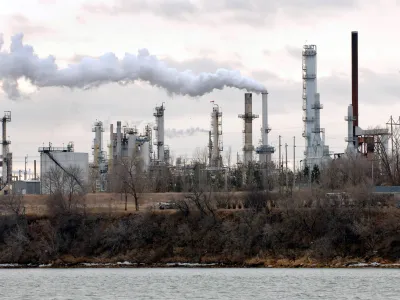 The Tesoro oil refinery is shown in operation on the west bank of the Missouri River in Mandan, N.D., on Tuesday, Dec. 13, 2005. Parts of the Bismarck-Mandan area had some of the worst air in the nation in terms of health risk from industrial air polution in 2000, a new analysis by the Associated Press shows. (AP Photo/Will Kincaid)