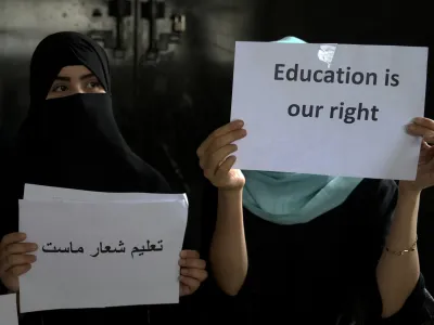 Afghan girls hold illegal protest to demand the right to education in a private home in Kabul, Afghanistan, Tuesday, Aug. 2, 2022. For most teenage girls in Afghanistan, it's been a year since they set foot in a classroom. With no sign the ruling Taliban will allow them back to school, some girls and parents are trying to find ways to keep education from stalling for a generation of young women. (AP Photo/Ebrahim Noroozi)