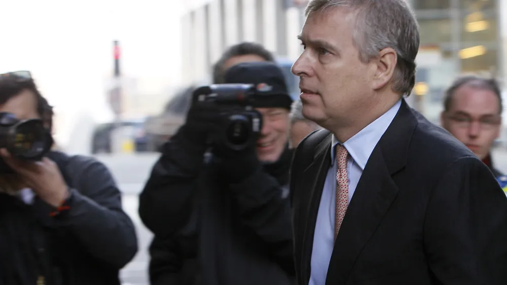 Britain's Prince Andrew arrives in Canary Wharf, London, to visit the headquarters of the London CrossRail project in London, Monday, March, 7, 2011. Prince Andrew will have to decide whether he can continue his role as a trade envoy amid a controversy about his links to a convicted pedophile, a British Cabinet minister said Monday. (AP Photo/Alastair Grant)