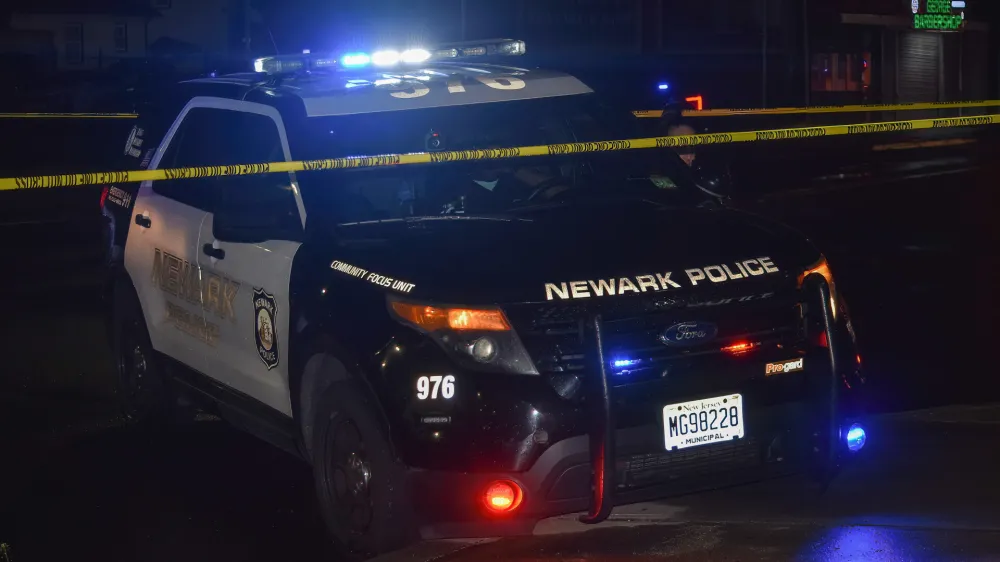 15 April 2023, US, Newark: A police vehicle blocks the crime scene in the area of Chancellor Avenue, where four people were shot in a mass shooting in Newark. Photo: Kyle Mazza/SOPA Images via ZUMA Press Wire/dpa