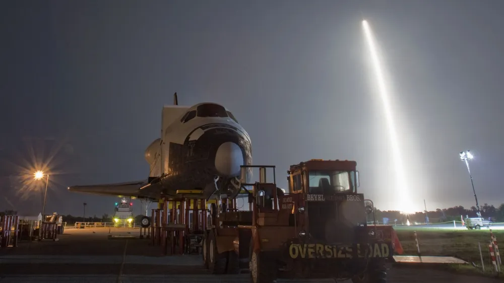 The SpaceX Falcon 9 test rocket lifts off from Space Launch Complex 40 at the Cape Canaveral Air Force Station in Cape Canaveral, Florida May 22, 2012. The rocket blasted off on Tuesday for a mission designed to be the first commercial flight to the International Space Station. The mock shuttle Explorer, in the foreground, had been on display at the Kennedy Space Center Complex, and will be moved to the Johnson Space Center in Houston this week in order to make room for the arrival of Space Shuttle Atlantis. REUTERS/Pierre DuCharme (UNITED STATES - Tags: SCIENCE TECHNOLOGY TRANSPORT TPX IMAGES OF THE DAY)