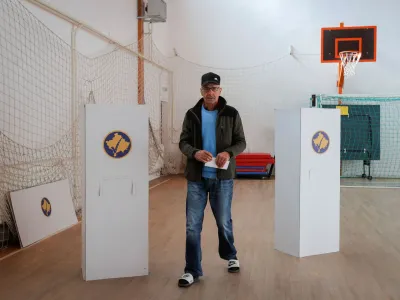 A Kosovo Albanian man prepares to vote at a polling station in the village of Qabra, Kosovo, April 23, 2023. REUTERS/Valdrin Xhemaj NO RESALES. NO ARCHIVES.