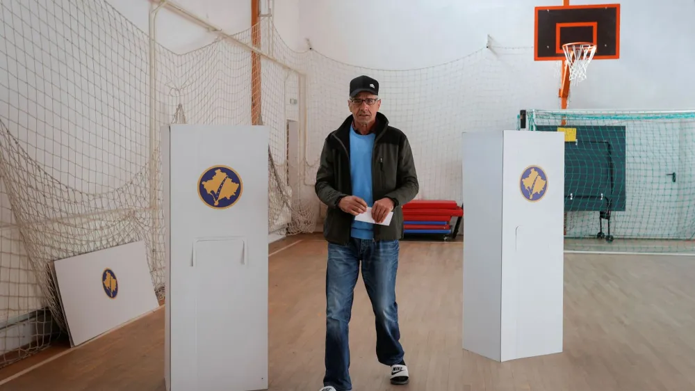 A Kosovo Albanian man prepares to vote at a polling station in the village of Qabra, Kosovo, April 23, 2023. REUTERS/Valdrin Xhemaj NO RESALES. NO ARCHIVES.