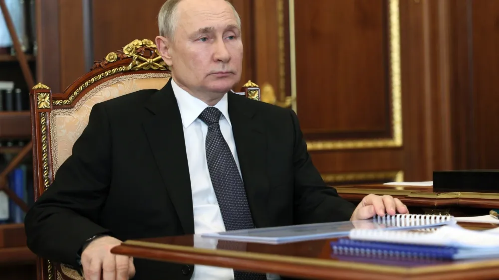 Russian President Vladimir Putin listens to United Russia Party General Council Secretary Andrei Turchak during their meeting at the Kremlin in Moscow, Russia, Monday, April 24, 2023. (Mikhail Klimentyev/Sputnik, Kremlin Pool Photo via AP)