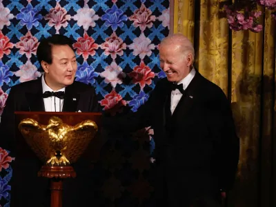 U.S. President Joe Biden reacts as South Korea's President Yoon Suk Yeol speaks during an official State Dinner in Washington, U.S. April 26, 2023. REUTERS/Evelyn Hockstein