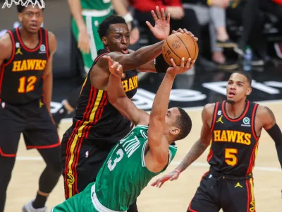 Apr 27, 2023; Atlanta, Georgia, USA; Atlanta Hawks forward Onyeka Okongwu (17) blocks the shot of Boston Celtics guard Malcolm Brogdon (13) in the second half during game six of the 2023 NBA playoffs at State Farm Arena. Mandatory Credit: Brett Davis-USA TODAY Sports