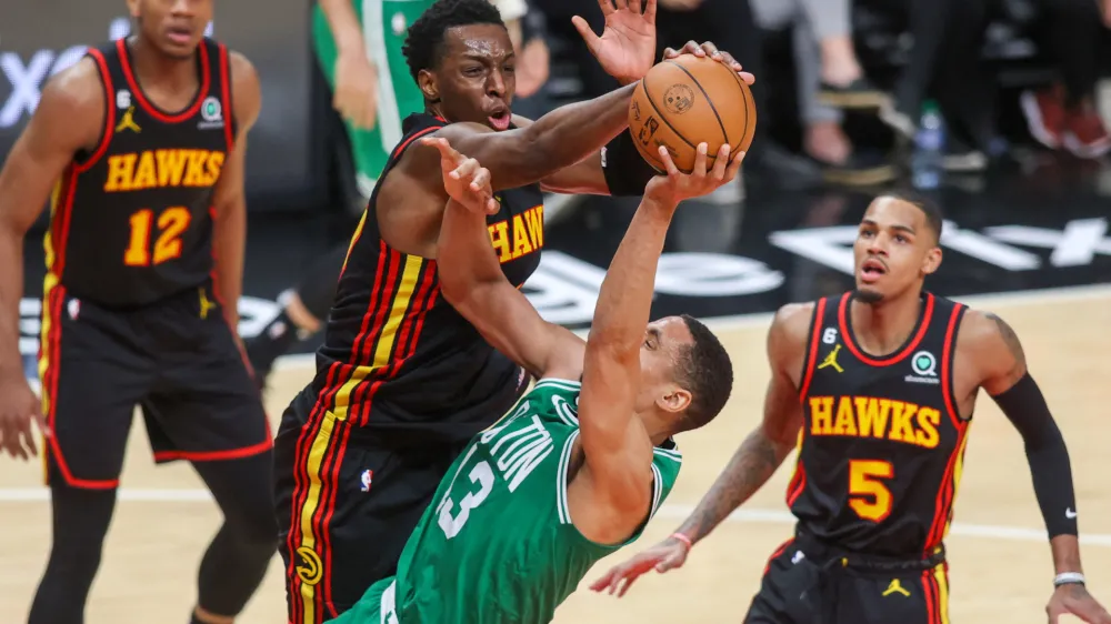 Apr 27, 2023; Atlanta, Georgia, USA; Atlanta Hawks forward Onyeka Okongwu (17) blocks the shot of Boston Celtics guard Malcolm Brogdon (13) in the second half during game six of the 2023 NBA playoffs at State Farm Arena. Mandatory Credit: Brett Davis-USA TODAY Sports