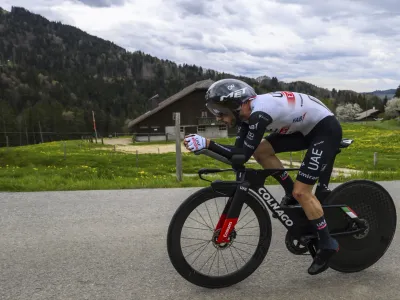 Britain's Adam Yates pedals during the third stage, a 18,75 km race against the clock around Chatel-Saint-Denis at the 76th Tour de Romandie UCI World Tour Cycling race, in Chatel-Saint-Denis, Switzerland, Friday, April 28, 2023. (Jean-Christophe Bott/Keystone via AP)