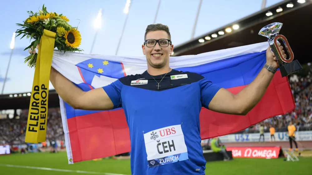 Kristjan Ceh of Slovenia celebrates with the Diamond League Trophy after winning the Discus Throw Men during the Weltklasse IAAF Diamond League international athletics meeting at the Letzigrund stadium in Zurich, Switzerland, Thursday, Sept. 8, 2022. (Jean-Christophe Bott/Keystone via AP)