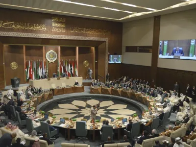 In this photo released by Egypt's Ministry of Foreign Affairs, delegates and foreign ministers of member states convene at the Arab League headquarters in Cairo, Egypt, Sunday, May 7, 2023. The ministers are voting on restoring Syria's membership to the organization after it was suspended over a decade ago. The meeting comes after a rapid rapprochement between Syria and regional governments since February. (Egyptian Ministry of Foreign Affairs via AP)