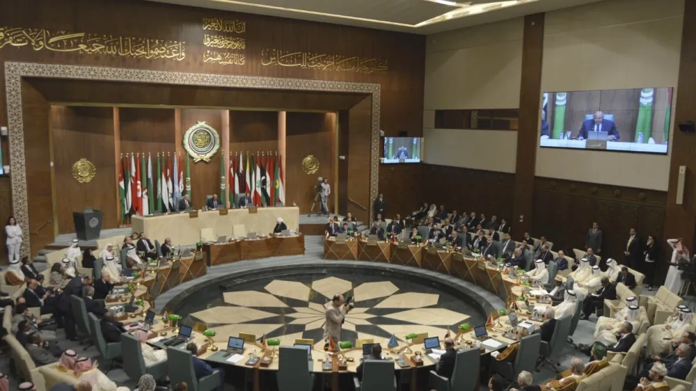 In this photo released by Egypt's Ministry of Foreign Affairs, delegates and foreign ministers of member states convene at the Arab League headquarters in Cairo, Egypt, Sunday, May 7, 2023. The ministers are voting on restoring Syria's membership to the organization after it was suspended over a decade ago. The meeting comes after a rapid rapprochement between Syria and regional governments since February. (Egyptian Ministry of Foreign Affairs via AP)