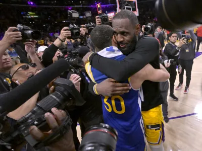 May 12, 2023; Los Angeles, California, USA; Los Angeles Lakers forward LeBron James (6) and Golden State Warriors guard Stephen Curry (30) embrace after game six of the 2023 NBA playoffs at Crypto.com Arena. Mandatory Credit: Jayne Kamin-Oncea-USA TODAY Sports