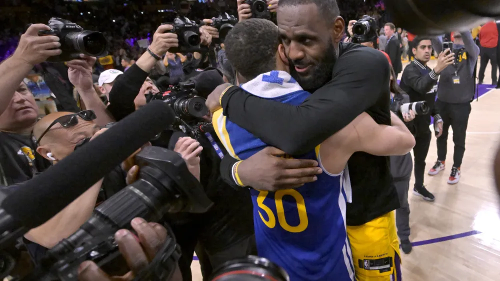 May 12, 2023; Los Angeles, California, USA; Los Angeles Lakers forward LeBron James (6) and Golden State Warriors guard Stephen Curry (30) embrace after game six of the 2023 NBA playoffs at Crypto.com Arena. Mandatory Credit: Jayne Kamin-Oncea-USA TODAY Sports