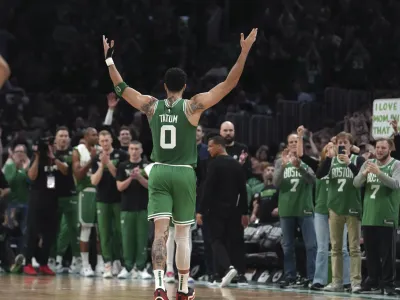 Boston Celtics forward Jayson Tatum (0) receives applause as he steps off the court near the end of Game 7 against the Philadelphia 76ers in the NBA basketball Eastern Conference semifinal playoff series, Sunday, May 14, 2023, in Boston. (AP Photo/Steven Senne)