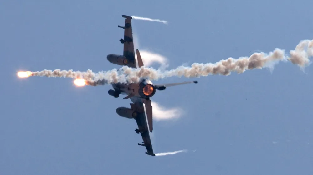 FILE - In this July 20, 2006 file photo, a U.S.-made F-16 fighter jet launches flares as he rolls on the side during the the annual Han Kuang No. 22 exercises, off Ilan, 80 kilometers, 49 miles, west of Taipei, Taiwan. China denounced a decision by the United States to upgrade Taiwan's F-16 fighter jets, summoning the U.S. ambassador and warning that military ties and overall relations will suffer, on Thursday, Sept. 22, 2011. (AP Photo, File)
