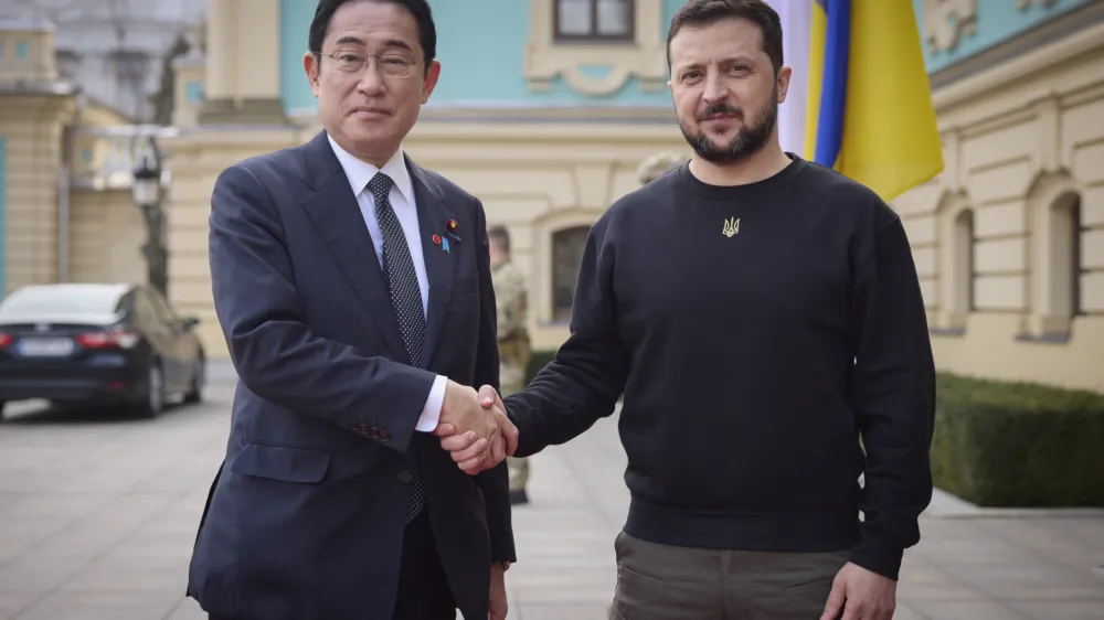 FILE - Japanese Prime Minister Fumio Kishida, left, and Ukrainian President Volodymyr Zelenskyy, right, greet each other during their meeting in Kyiv, Ukraine, March 21, 2023. President Zelenskyy will join leaders of the world's most powerful democracies in Hiroshima, Japan, making his furthest trip from of his war-torn country as leaders are set to unveil new sanctions on Russia for its invasion.(Ukrainian Presidential Press Office via AP, File)