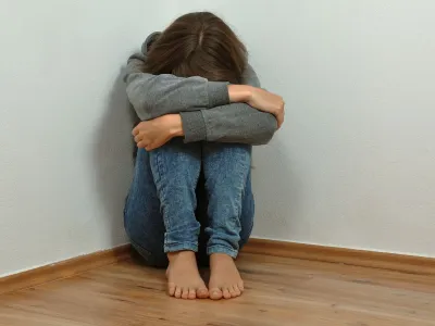 ﻿Lonely girl crying in the corner