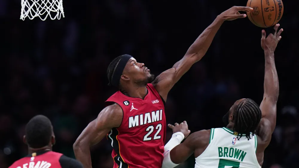 May 19, 2023; Boston, Massachusetts, USA; Miami Heat forward Jimmy Butler (22) defends a shot by Boston Celtics guard Jaylen Brown (7) during the second half of game two of the Eastern Conference Finals for the 2023 NBA playoffs at TD Garden. Mandatory Credit: David Butler II-USA TODAY Sports