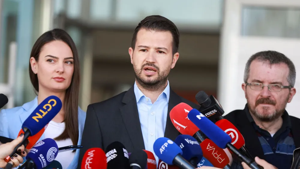 Jakov Milatovic, a presidential candidate from the Europe Now Movement, speaks to the media as he votes at a polling station along with his wife Milena during the run-off presidential elections in Podgorica, Montenegro, April 2, 2023. REUTERS/Marko Djurica