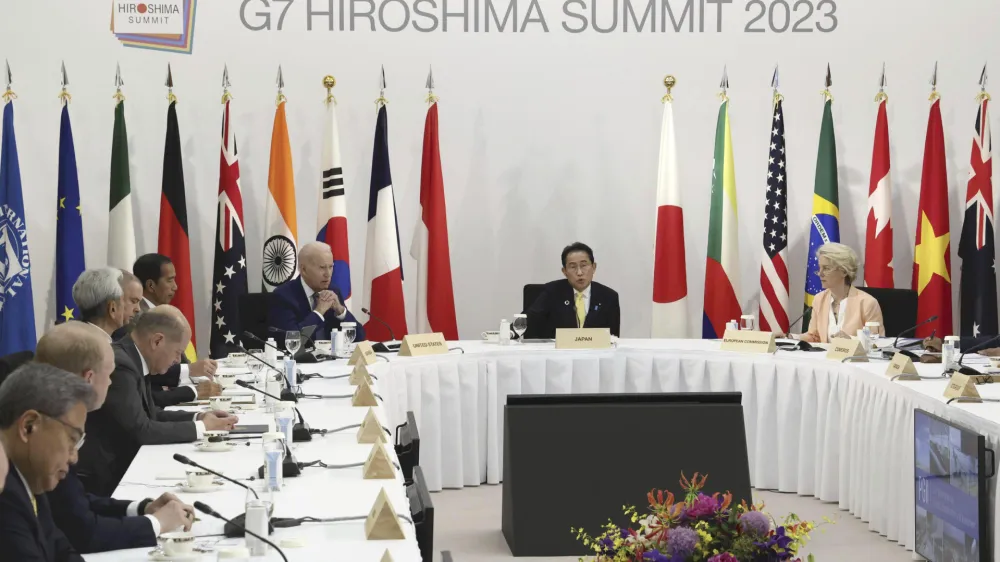 U.S. President Joe Biden, center left, Japanese Prime Minister Fumio Kishida, center, European Commission President Ursula von der Leyen, right, attend an event on global infrastructure and investment during the G7 Summit in Hiroshima, Japan, Saturday, May 20, 2023. (Japan Pool via AP)