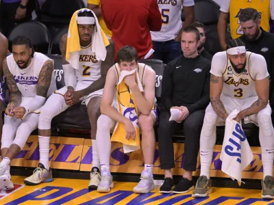 May 20, 2023; Los Angeles, California, USA; Los Angeles Lakers forward Jarred Vanderbilt (2) and guard Austin Reaves (15) and forward Anthony Davis (3) react in the fourth quarter against the Denver Nuggets during game three of the Western Conference Finals for the 2023 NBA playoffs at Crypto.com Arena. Mandatory Credit: Jayne Kamin-Oncea-USA TODAY Sports