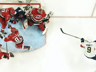 May 20, 2023; Raleigh, North Carolina, USA; Carolina Hurricanes goaltender Antti Raanta (32) makes a save off a shot by Florida Panthers center Sam Bennett (9) during the first period in game two of the Eastern Conference Finals of the 2023 Stanley Cup Playoffs at PNC Arena. Mandatory Credit: James Guillory-USA TODAY Sports