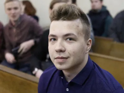 FILE PHOTO: Opposition blogger and activist Roman Protasevich, who is accused of participating in an unsanctioned protest at the Kuropaty preserve, waits before the beginning of a court hearing in Minsk, Belarus April 10, 2017. REUTERS/Stringer/File Photo