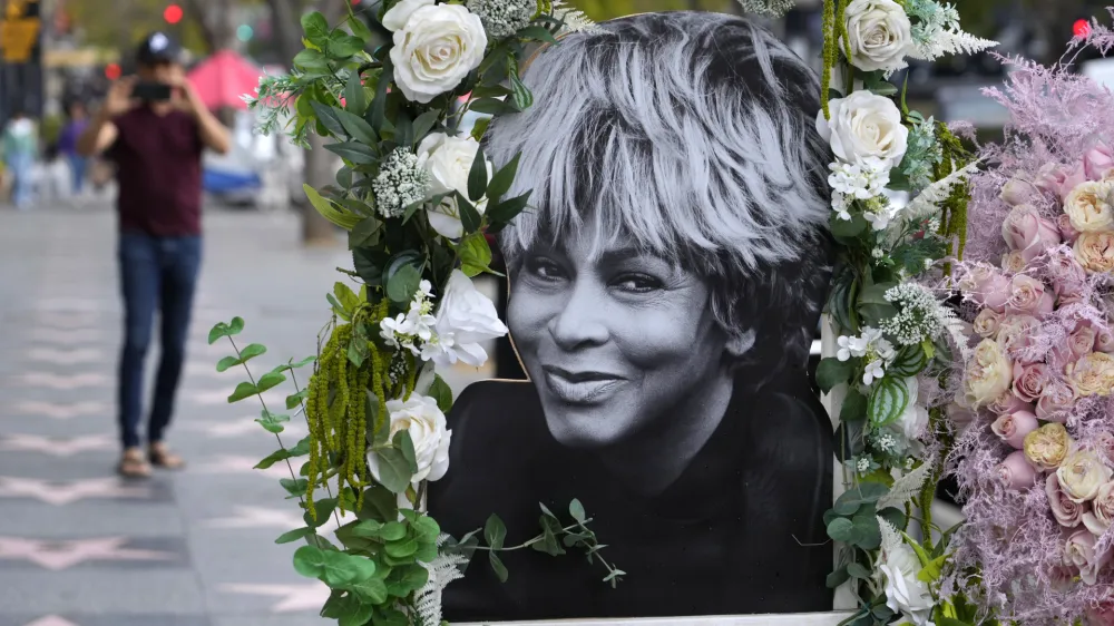 A portrait of the late singer Tina Turner stands atop her star on the Hollywood Walk of Fame, Wednesday, May 24, 2023, in Los Angeles. Turner died Tuesday at 83 after a long illness. (AP Photo/Chris Pizzello)