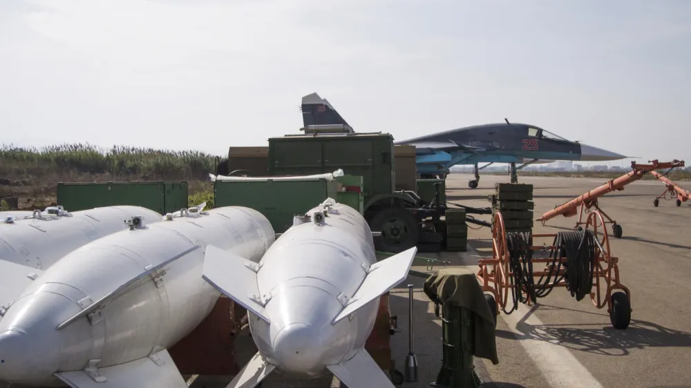 ﻿FILE - In this Thursday, Oct. 22, 2015, file photo, bombs lie near a Russian war plane at Hemeimeem airbase, Syria. When Russian Foreign Minister Sergey Lavrov said his country is ready to aid Syrian rebels fighting Islamic State militants on the ground, rebel commanders scoffed at the notion, pointing out that Russian aircraft were pounding rebel bases in central and northern Syria on daily basis. (AP Photo/Vladimir Isachenkov, File)