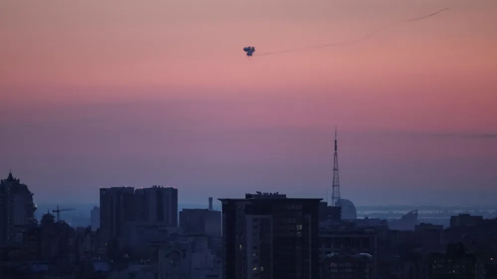 An explosion of a missile is seen in the sky over the city during a Russian missile strike, amid Russia's attack on Ukraine, in Kyiv, Ukraine May 26, 2023. REUTERS/Gleb Garanich