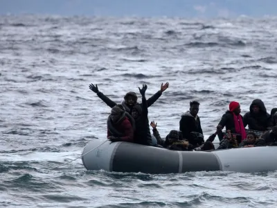 FILE PHOTO: Migrants from sub-saharan African countries on a dinghy react as they are towed by a rescue boat during their effort to cross part of the Aegean Sea from Turkey to the island of Lesbos, Greece, February 29, 2020. REUTERS/Alkis Konstantinidis/File Photo