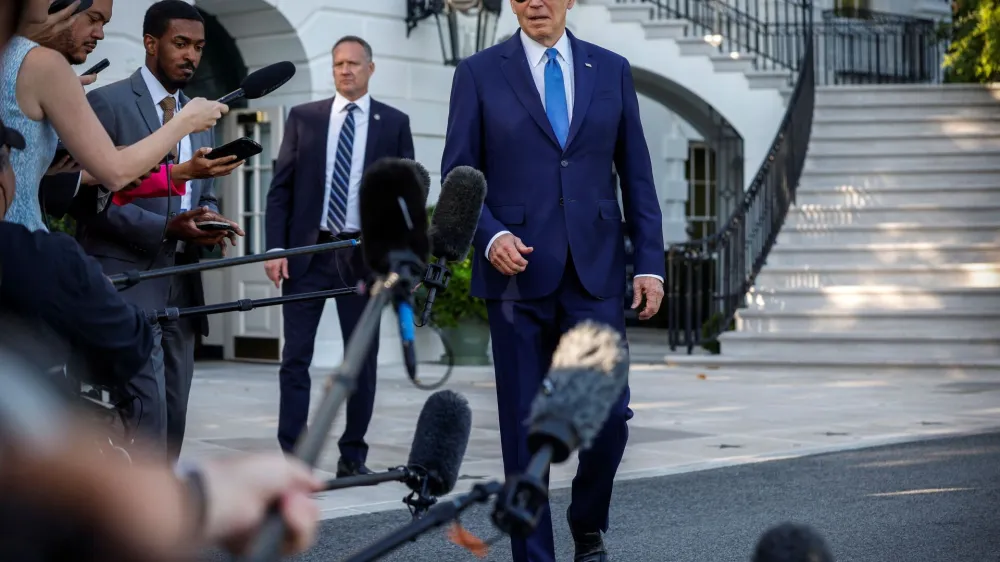 U.S. President Joe Biden speaks to the media before departing the White House for Camp David, in Washington, U.S., May 26, 2023. REUTERS/Evelyn Hockstein