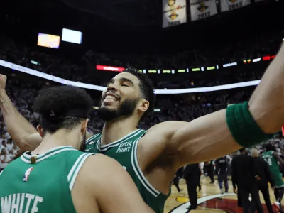 May 27, 2023; Miami, Florida, USA; Boston Celtics guard Derrick White (9) celebrates with forward Jayson Tatum (0) after defeating the Miami Heat in game six of the Eastern Conference Finals for the 2023 NBA playoffs at Kaseya Center. Mandatory Credit: Sam Navarro-USA TODAY Sports