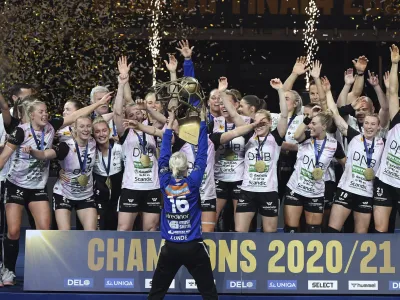 ﻿Players of Vipers Kristiansand celebrate with the trophy after they won women's handball Champions' League final match Vipers Kristiansand vs. Brest Bretagne Handball in Papp Laszlo Budapest Sports Arena in Budapest, Hungary, Sunday, May 30, 2021. (Tibor Illyes/MTI via AP)