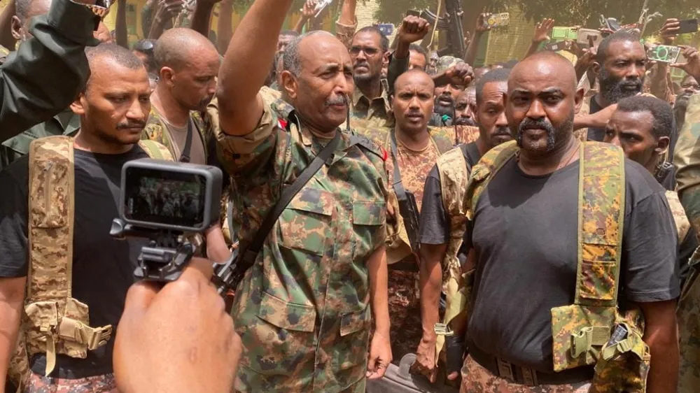 Sudan's General Abdel Fattah al-Burhan stands among troops,in an unknown location, in this picture released on May 30, 2023. Sudanese Armed Forces/Handout via REUTERS  THIS IMAGE HAS BEEN SUPPLIED BY A THIRD PARTY. MANDATORY CREDIT