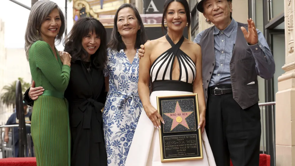 Ming-Na Wen, second right, known for her roles in "The Joy Luck Club" and "Mulan," poses atop her star on the Hollywood Walk of Fame during a ceremony on Tuesday, May 30, 2023, in Los Angeles. Pictured with Wen are fellow "The Joy Luck Club" co-stars Tamlyn Tomita, from left, Lauren Tom and Rosalind Chao, and at right, "Agents of S.H.I.E.L.D." co-star James Hong. (Photo by Willy Sanjuan/Invision/AP)