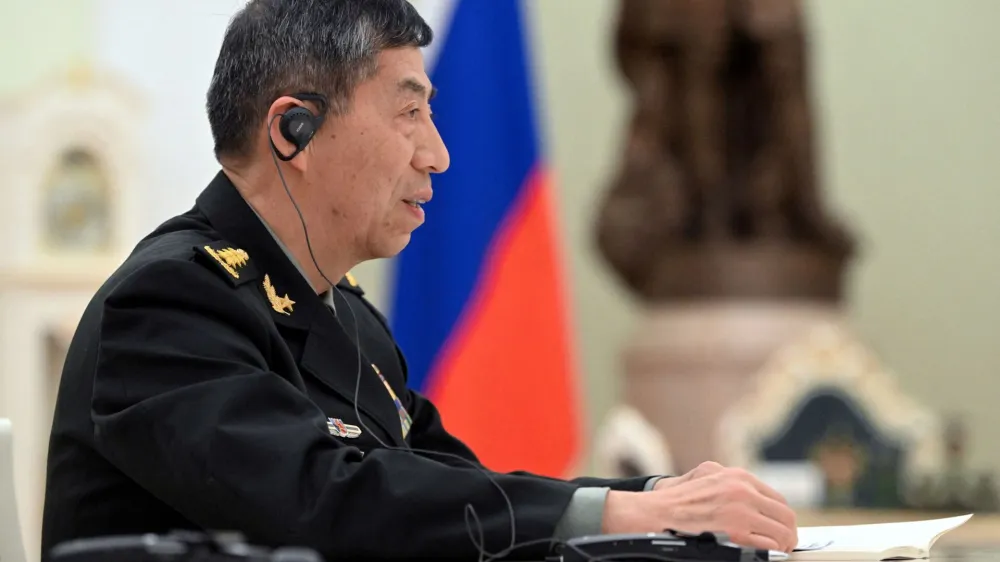 FILE PHOTO: Chinese Defence Minister Li Shangfu attends a meeting with Russian President Vladimir Putin and Defence Minister Sergei Shoigu in Moscow, Russia, April 16, 2023. Sputnik/Pavel Bednyakov/Pool via REUTERS ATTENTION EDITORS - THIS IMAGE WAS PROVIDED BY A THIRD PARTY./File Photo