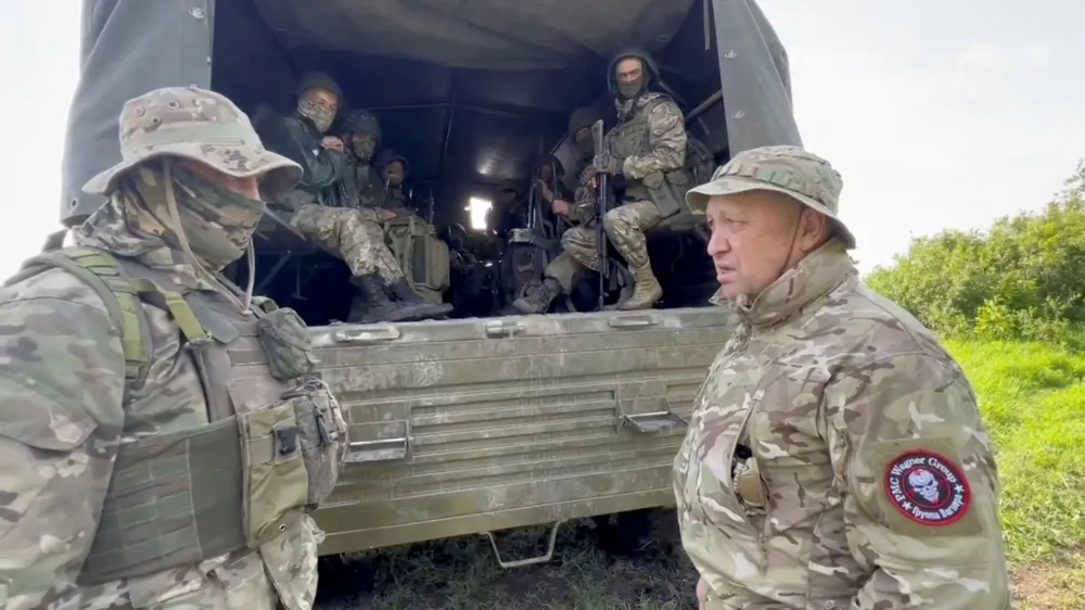 Founder of Wagner private mercenary group Yevgeny Prigozhin speaks with servicemen during withdrawal of his forces from Bakhmut and handing over their positions to regular Russian troops, in the course of Russia-Ukraine conflict in an unidentified location, Russian-controlled Ukraine, in this still image taken from video released June 1, 2023. Press service of "Concord"/Handout via REUTERS ATTENTION EDITORS - THIS IMAGE WAS PROVIDED BY A THIRD PARTY. NO RESALES. NO ARCHIVES. MANDATORY CREDIT.