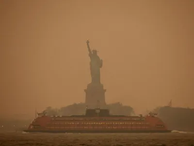 The Statue of Liberty is covered in haze and smoke caused by wildfires in Canada, in New York, U.S., June 6, 2023. REUTERS/Amr Alfiky