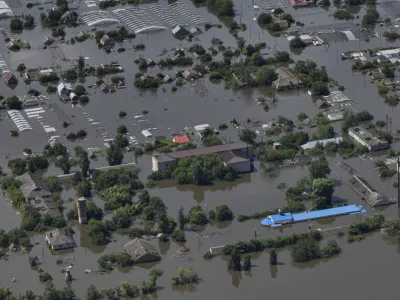 Houses are seen underwater in the flooded village of Dnipryany after the collapse of Kakhovka Dam, in Ukraine, Wednesday, June 7, 2023. (AP Photo)