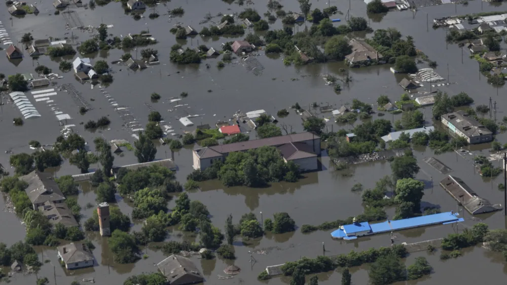 Houses are seen underwater in the flooded village of Dnipryany after the collapse of Kakhovka Dam, in Ukraine, Wednesday, June 7, 2023. (AP Photo)