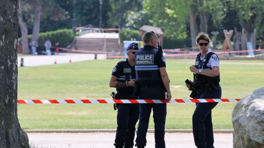 French police secure the area after several children and an adult have been injured in a knife attack in Annecy, in the French Alps, France, June 8, 2023. REUTERS/Denis Balibouse