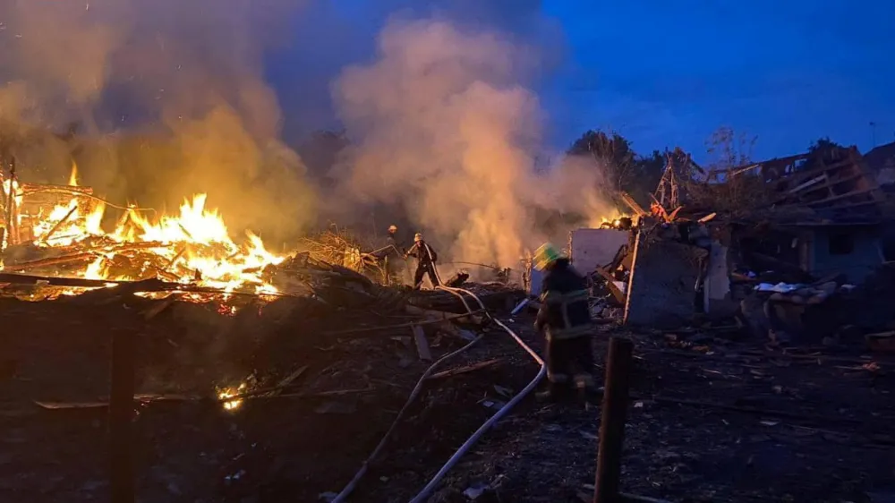 Firefighters work at a site of residential houses destroyed during a Russian missile strike, amid Russia's attack on Ukraine, in the town of Zviahel, Zhytomyr region, Ukraine, in this handout picture released June 9, 2023. Press service of the State Emergency Service of Ukraine in Zhytomyr region/Handout via REUTERS ATTENTION EDITORS - THIS IMAGE HAS BEEN SUPPLIED BY A THIRD PARTY. DO NOT OBSCURE LOGO.