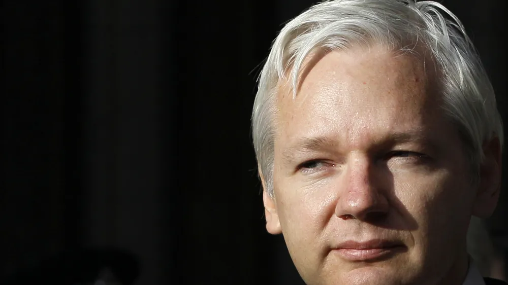 FILE - WikiLeaks founder Julian Assange pauses as he makes a statement to media gathered outside the High Court in London, on Dec. 5, 2011. Australia's Prime Minister Anthony Albanese said Wednesday, Nov. 30, 2022, he recently told U.S. President Joe Biden's administration to bring WikiLeaks founder and Australian citizen Julian Assange's prosecution to a close. (AP Photo/Kirsty Wigglesworth, File)