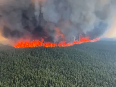 Smoke rises from a wildfire in Tumbler Ridge, British Columbia, Canada, in this screen grab taken from a video, June 8, 2023. BC Wildlife Service/Handout via REUTERS  THIS IMAGE HAS BEEN SUPPLIED BY A THIRD PARTY MANDATORY CREDIT NO RESALES. NO ARCHIVES.