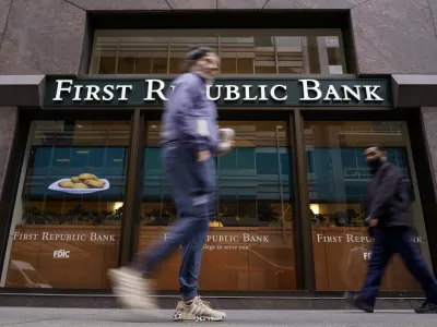 Pedestrians walk past the headquarters of First Republic Bank in San Francisco, Monday, May 1, 2023. The Fed's interest rate decision, announced on Wednesday, comes against the backdrop of both still-high inflation and the persistent turmoil in the banking industry. (AP Photo/Godofredo A. Vásquez)