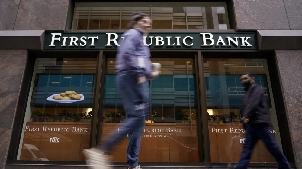 Pedestrians walk past the headquarters of First Republic Bank in San Francisco, Monday, May 1, 2023. The Fed's interest rate decision, announced on Wednesday, comes against the backdrop of both still-high inflation and the persistent turmoil in the banking industry. (AP Photo/Godofredo A. Vásquez)