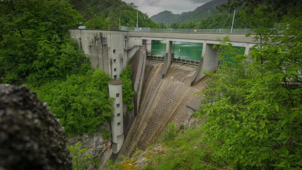 Small but steep dam for hydroelectric plant in Moste, Slovenia. View of the hidroelectric dam from above, looking down.